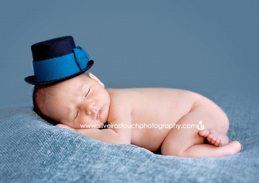 Dapper cute baby in dapper hat posing