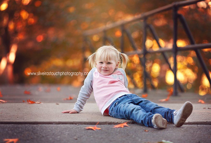 NJ children portraits at Nutley Park with fall colors leaves on ground