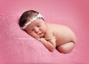 newborn photography in mt. olive NJ of baby laying on pink blanket