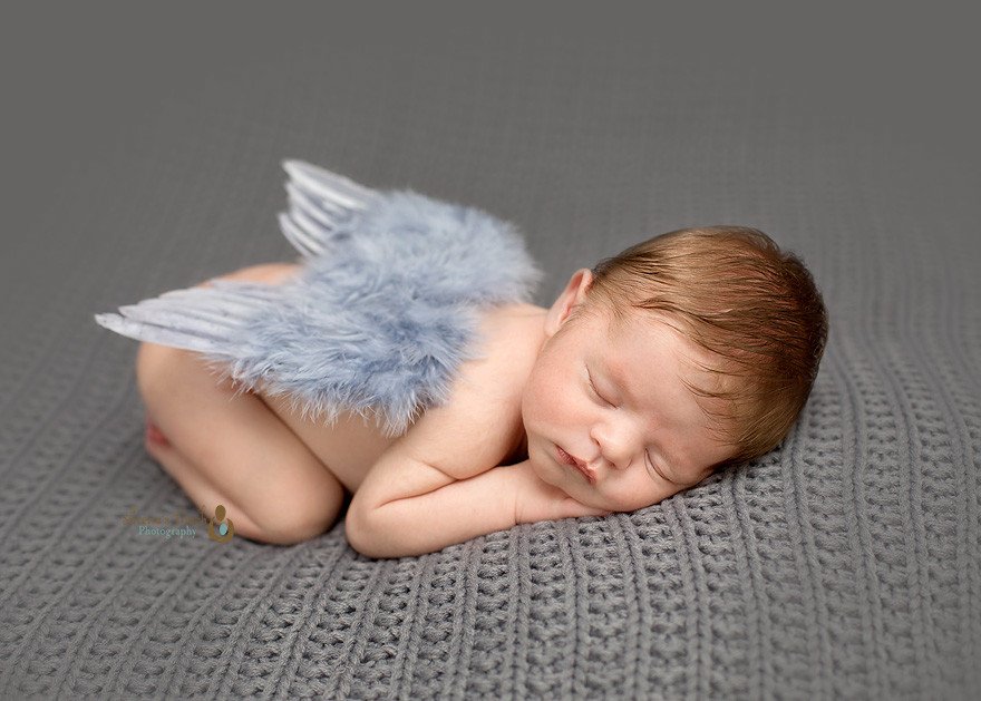 Newborn photography of baby boy with angel wings taking in Pomptain Plains NJ studio
