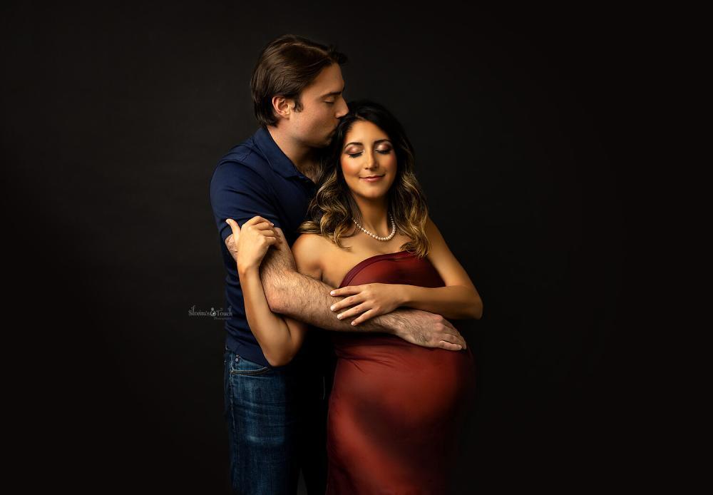 maternity couple photos embracing the love of each other