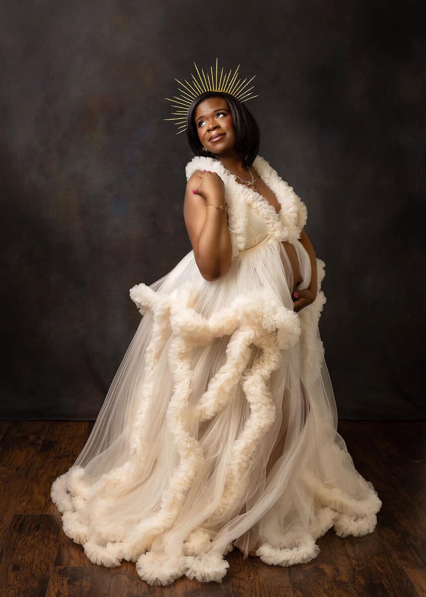 professional maternity photography of mom wearing couture pink gown and crown