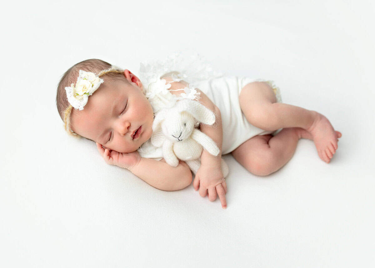 baby girl photoshoot holding a white bunny captured in Mount olive NJ by Silveira's Touch Photography