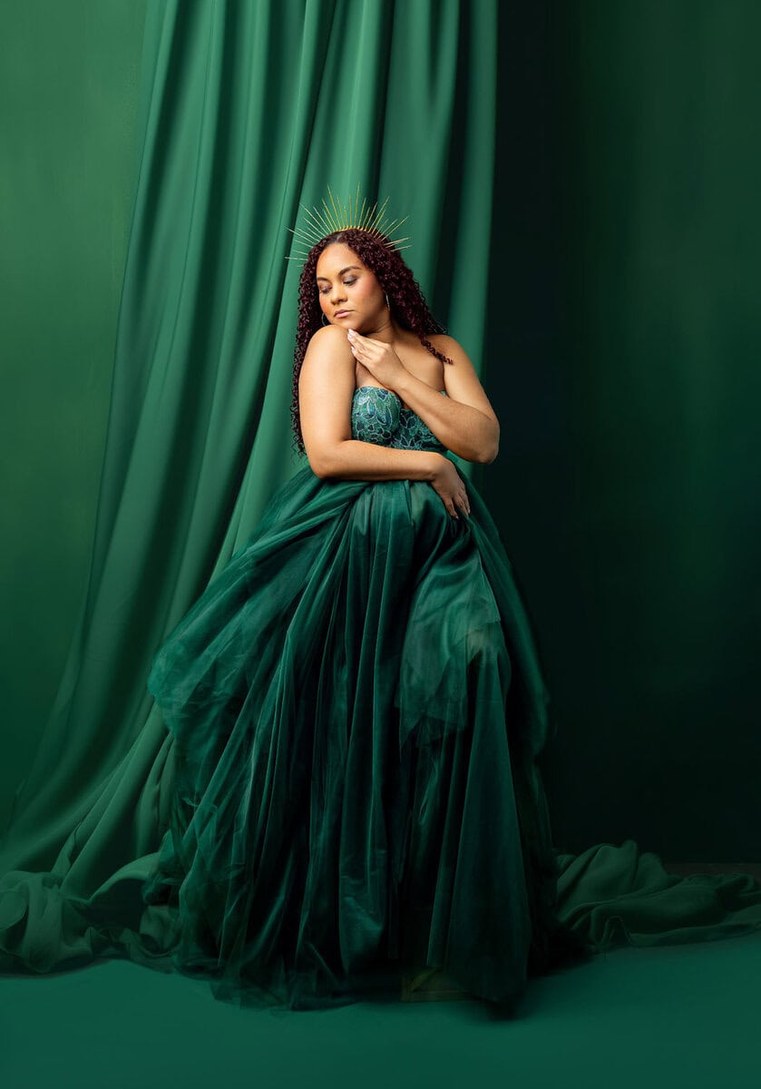 Pregnancy photoshoot of mom wearing green designer dress in studio at Silveira's touch photo in New Jersey