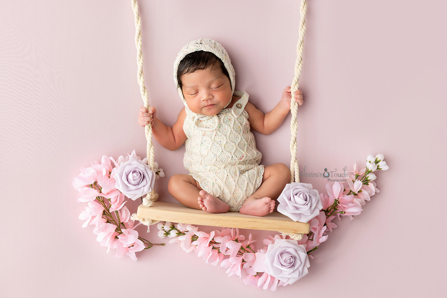 newborn girl on floral swing photography